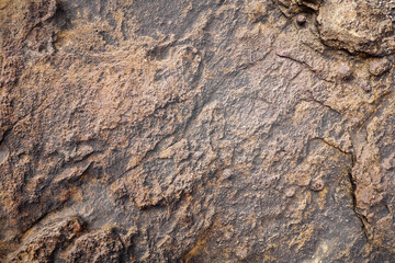 Empty black brown stone wall on rock for abstract  background and texture. beautiful patterns, space for work, banner,seamless wallpaper, close up.