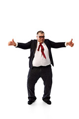 Motivation for employees. Fat businessman in black suit and glasses, dancing, showing positive energy isolated on white background. Concept of business, leisure, achievement