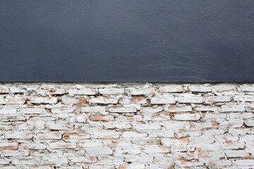 White brick and grey concrete wall