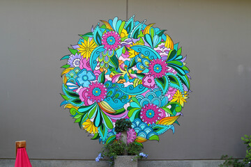 The colorful flower painting on the concrete wall