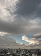 Beautiful Clouds in the Sky over Large Metropolitan City of Bangkok. View of Skyscrapers and Dramatic Sky before Sunset, Space for text, Selective focus.