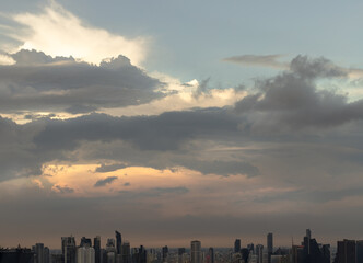 Beautiful Clouds in the Sky over Large Metropolitan City of Bangkok. View of Skyscrapers and Dramatic Sky before Sunset, Space for text, Selective focus.