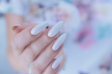 beautiful female hands with long nails light white manicure