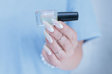 beautiful female hands with long nails light white manicure