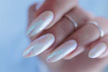 beautiful female hands with long nails light white manicure