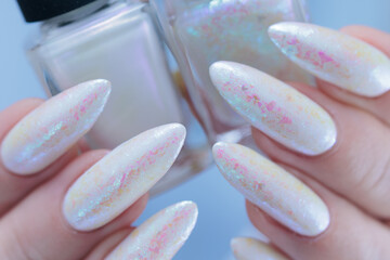 beautiful female hands with long nails light white manicure