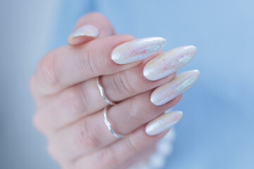 beautiful female hands with long nails light white manicure