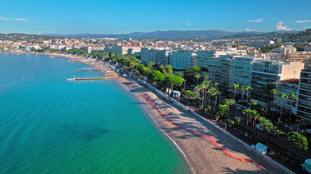 Aerial view of Cannes famous resort town on the coastal French Riviera. Luxury travel destination in France, town with sandy beaches Croisette Beach Cannes and palatial hotels.