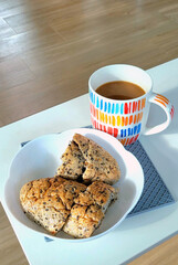 A simple refreshment, a few slices of multigrain bread and a cup of coffee