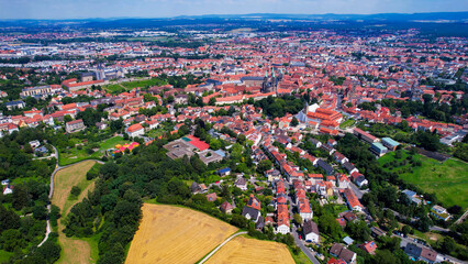 A panorama Aerial view around the old town of the city Bamberg on an early summer day in Germany.