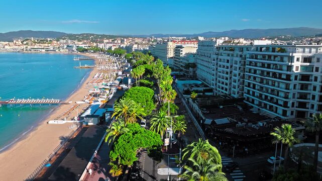 Aerial view of Cannes famous resort town on the coastal French Riviera. Luxury travel destination in France, town with sandy beaches Croisette Beach Cannes and palatial hotels.