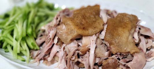 Shredded chicken with cucumber strips