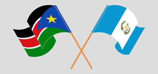 Crossed and waving flags of South Sudan and Republic of Guatemala