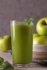 apple smoothie in a glass on the table