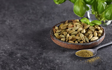 organic cardamom spice in bowl on table