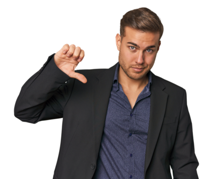 Businessman in suit, studio shot showing a dislike gesture, thumbs down. Disagreement concept.