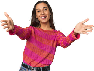 Hispanic young woman feels confident giving a hug to the camera.