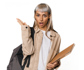 Caucasian young student with books surprised and shocked.