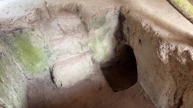 dungeon entrance tunnel camouflaged Cu Chi tunnels were the Viet Cong's base of operations for the Tet Offensive in 1968. Famous tourist attraction in Vietnam