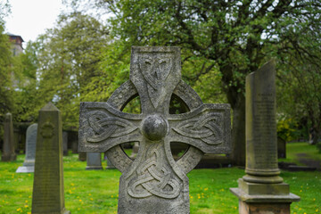 An old celtic cross at a cemetery