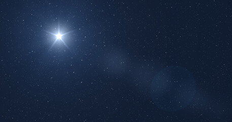 Star in the starry blue sky over the manger of christmas of Jesus Christ