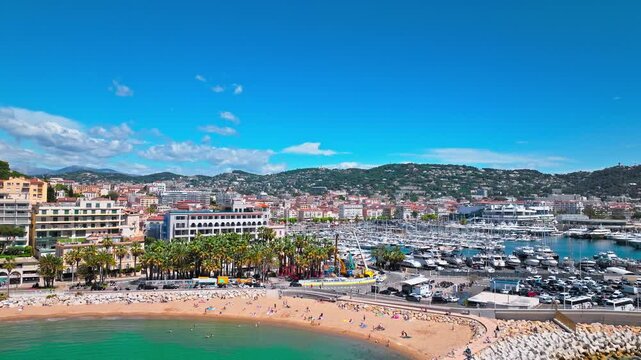 Aerial view of Cannes famous resort town on the coastal French Riviera. Luxury travel destination in France, town with sandy beaches and palatial hotels in Cannes, France.