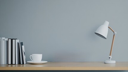 Stack of books, a reading lamp, and a cup of coffee, copy space on bookshelf