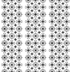 Vertical stripes of geometric floral patterns in black and white. This seamless design backgrounds, wallpapers, fabrics, and tiles, adding an elegant touch.