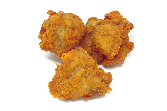 Fried popcorn chicken close up isolated on white background with shadow. Chicken karaage or Japanese breaded fried chicken.