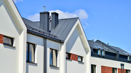 Terraced single family homes in newly developed housing estate. The real estate market in the suburbs. 