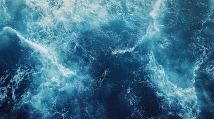 A mesmerizing view of deep blue ocean waves with white frothy crests, showcasing the power and beauty of nature.