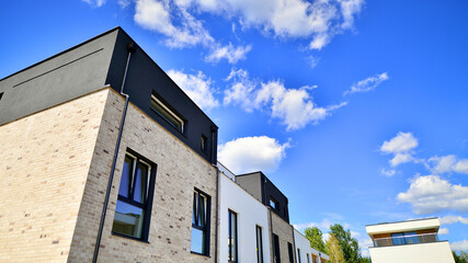 Terraced single family homes in newly developed housing estate. The real estate market in the...