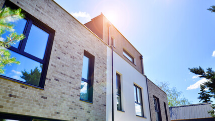 Terraced single family homes in newly developed housing estate. The real estate market in the suburbs. 