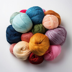 a lots colorfull ball of yarn for knitting on a white background