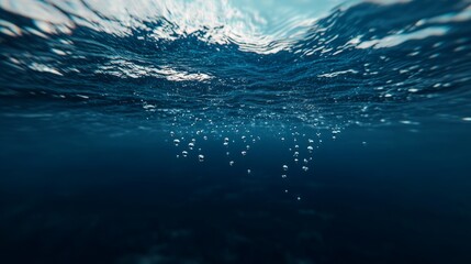 A mesmerizing underwater scene showcasing bubbles rising through the blue depths.