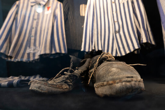 Handmade shoes and clothes worn by an inmate of Buchenwald Concentration Camp. Exhibition in the museum. Weimar, Germany, July 23 2024
