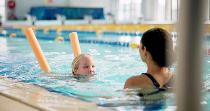 Mom, daughter and happy in swimming pool for lesson in centre for fun, bonding and recreation. Parent, kid and smile or excited for sport, support and care with training for child development - Powered by Adobe