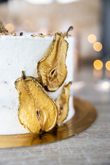 Spiced Pear Cake with vanilla cream, golden pear slices, star sprinkles