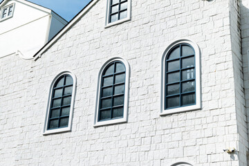 Classic circular window on house wall with blue sky,white round window,modern home decor,stylish home decor old apartament house london style.