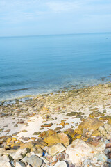 Beach sea with rocks and splashing waves,waves splashes on rock in sea shore,Summer vibe.