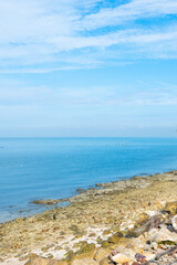 Beach sea with rocks and splashing waves,waves splashes on rock in sea shore,Summer vibe.