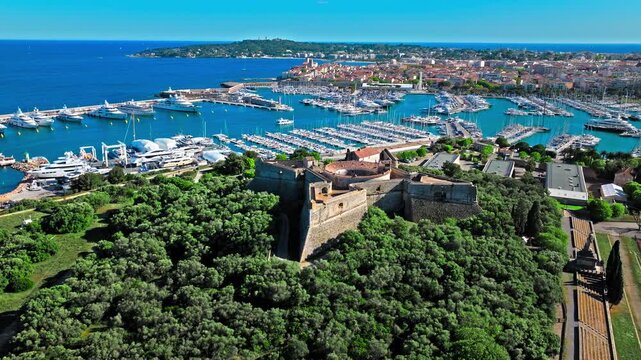 Drone view of Historical landmark star-shaped fort of four arrow-head-shaped bastions in Antibes.  Castle with a panoramic view of Le Fort Carr&eacute; and scenic view of Port Vauban on French Riviera.
