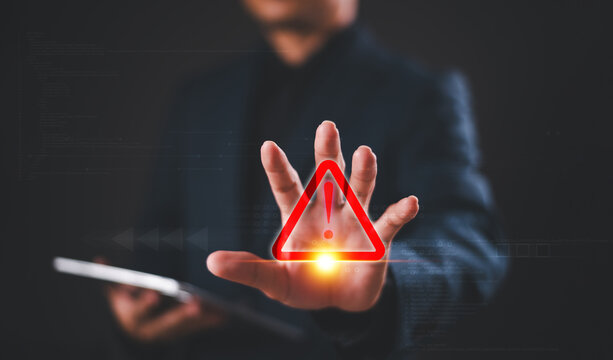 Alert warning icon concept. Developer or programmer use tablet to program access security caution triangle sign. Cybersecurity stop risk scam email on internet. Danger phishing fraud error attention