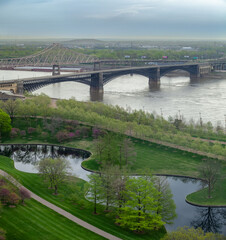 Ariel view of riverfront in St Louis with view of Gateway Arches National Park and Eads Bridge on Mississippi River
