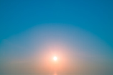 Natural delicate background, sky and sun at sunrise, color gradient from pink to blue, delicate and smooth transition