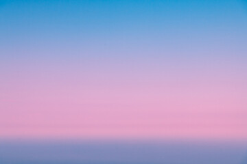 Natural background, sky at sunrise or sunset, color gradient from pink to blue, delicate and smooth transition