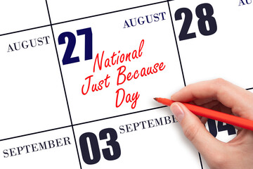 August 27. Hand writing text National Just Because Day on calendar date. Save the date.
