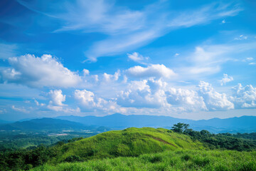 Lush Green Hill Under a Vivid Blue Sky with Fluffy Clouds Capturing Nature's Beauty