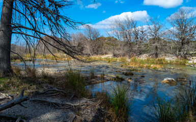 Frio River winding through scenic view of Hill Country terrain in Garner State Park