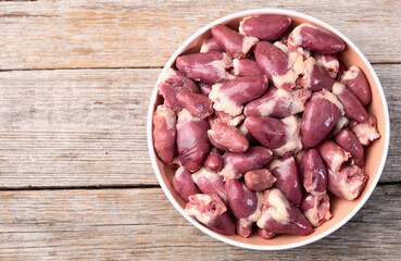 Raw chicken giblets hearts , meat background